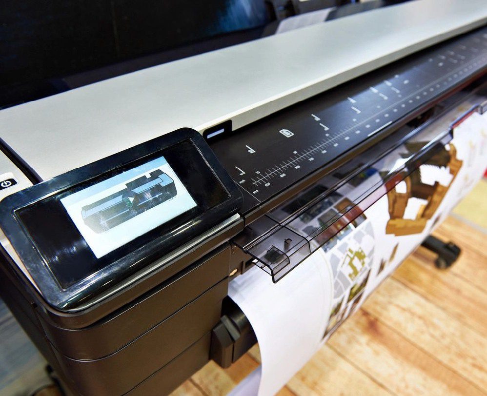 A printer with some papers on it