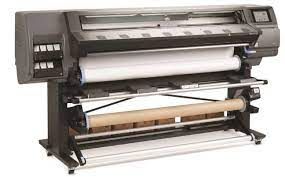 A large printer with two rolls of paper on it.