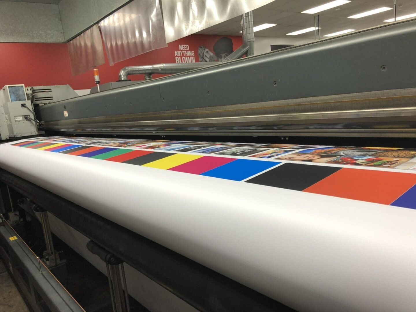 A large printer with colorful designs on it.