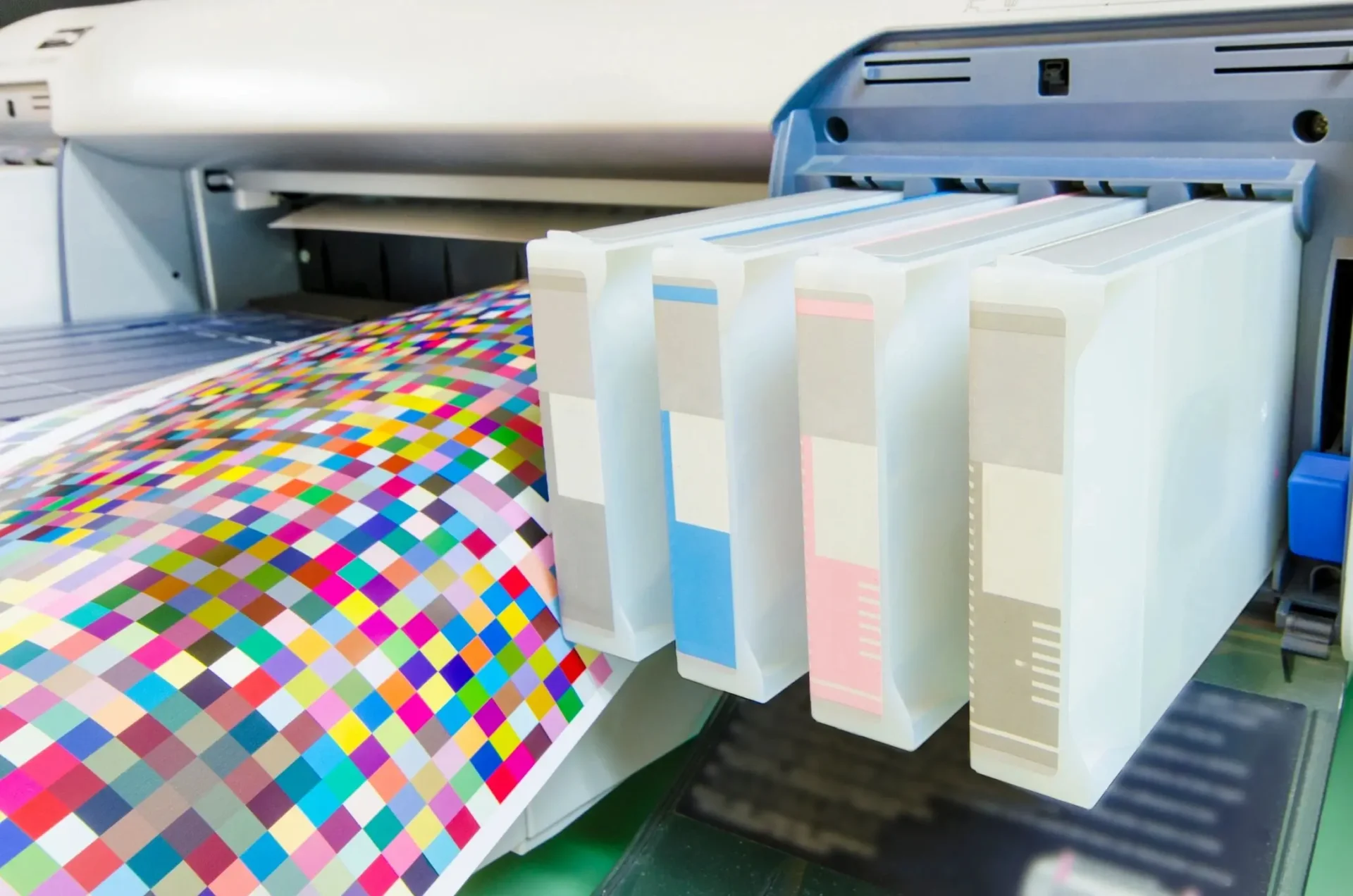 A printer with several boxes of different colors.