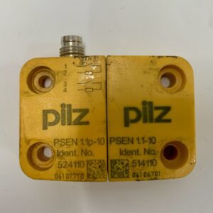 A yellow piece of metal with two wires attached to it.