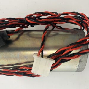 A close up of the wire on the side of a metal object.