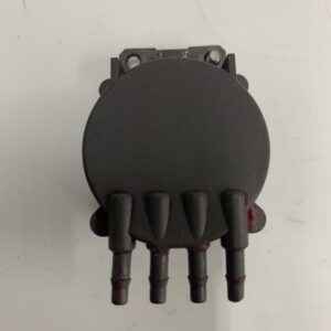 A black round shaped device with four terminals.