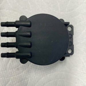 A black plastic device with six different plugs.