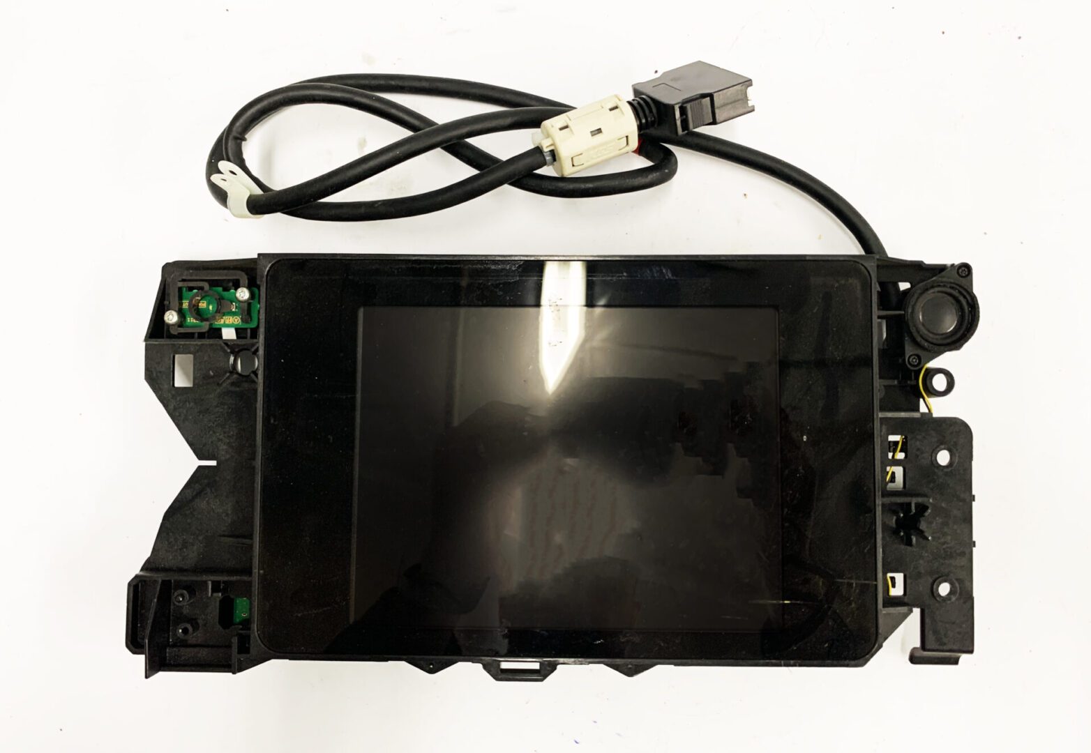 A black electronic device with wires attached to it.