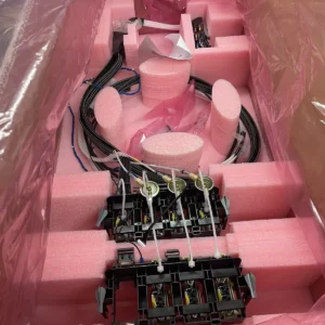 A pink box with many wires and some black