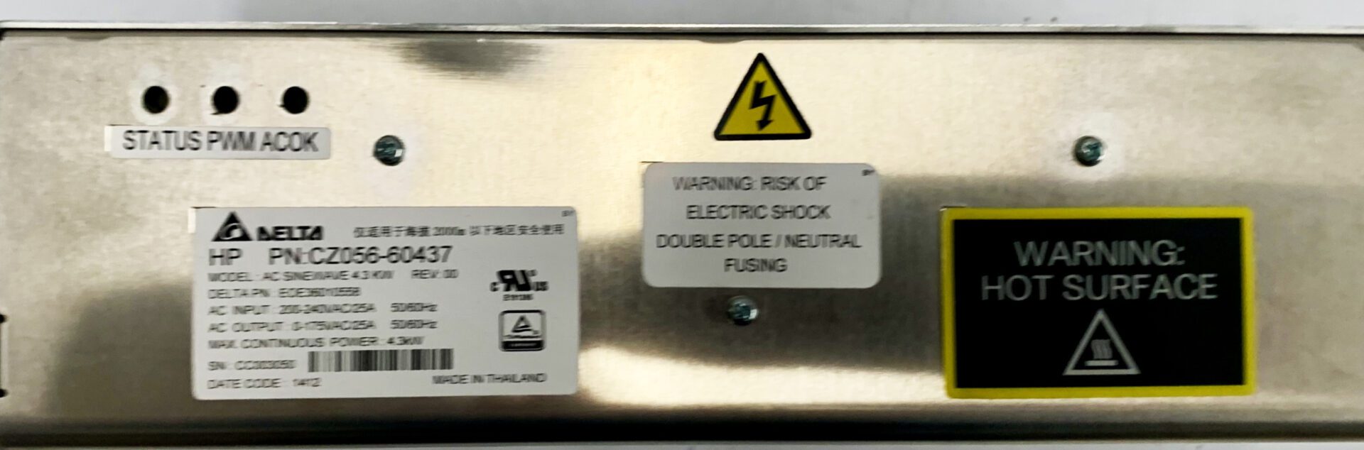 A close up of the warning sign on an electrical box.